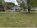 Quaint single story home with mature trees and a large lawn at 1306 Brantley Rd, Kannapolis, NC 28083