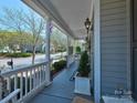 Cozy front porch with ample seating and scenic neighborhood views at 15323 Barnsbury Dr, Huntersville, NC 28078