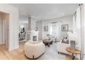 Bright living room features hardwood floors, a decorative fireplace, and ample seating with lots of natural light at 1824 Umstead St, Charlotte, NC 28205