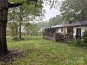 Expansive backyard with a wooden deck, perfect for outdoor dining and enjoying the scenery at 212 E Stewart Ave, Mooresville, NC 28115