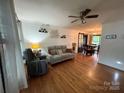 Bright living room featuring hardwood floors and a ceiling fan at 212 E Stewart Ave, Mooresville, NC 28115