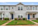Gray siding townhome with well-maintained lawn and landscaping at 221 Century Dr, Salisbury, NC 28147