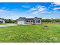 Charming single-story home featuring a two-car attached garage and a welcoming covered front porch at 3659 Kimber Ln, Sherrills Ford, NC 28673