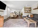 Open living space with dark floors, stylish furnishings, and abundant natural light at 402 Sidney Johnson St, Fort Mill, SC 29715