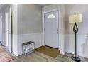 Welcoming foyer featuring neutral walls, stylish wainscoting and durable laminate flooring at 430 Coolidge Ave, Statesville, NC 28677