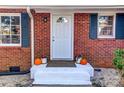 Inviting front entry featuring a decorative brick facade and freshly painted steps at 430 Coolidge Ave, Statesville, NC 28677