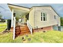 Spacious front porch with rocking chairs, offering an inviting spot for relaxation and enjoying the outdoors at 45 Oak St, Great Falls, SC 29055