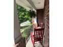 Cozy covered front porch with rocking chairs, perfect for enjoying the outdoors at 4711 Pearmain Dr, Waxhaw, NC 28173