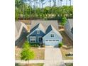 Aerial view of a well-maintained single-Gathering home with a two-car garage and neatly kept landscaping at 529 Cellini Pl # 243, Mount Holly, NC 28120