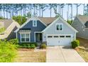 Beautiful home showcasing a two-car garage, nicely landscaped front yard, and durable siding at 529 Cellini Pl # 243, Mount Holly, NC 28120