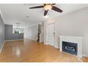 Bright living room featuring hardwood floors, fireplace and neutral color palette at 534 Donatello Ave, Charlotte, NC 28205