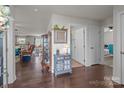 Spacious entryway featuring hardwood floors, stylish decor, and an open floor plan at 550 Cherry Blossom Nw Ave, Concord, NC 28027