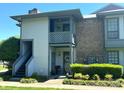 Charming condo exterior featuring a private entrance, balcony, and well-manicured landscaping at 5810 Harris Grove Ln, Charlotte, NC 28212