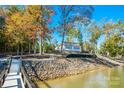 Beautiful lakeside home with meticulous landscaping and access to a private dock at 6788 Bucleigh Rd, Clover, SC 29710