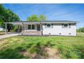Charming one-story home with fresh, neutral paint, inviting curb appeal and a neatly maintained lawn at 692 S Pink St, Cherryville, NC 28021