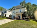 Inviting two-story home with a well-kept lawn and front yard landscaping at 8829 Michaw Ct, Charlotte, NC 28269