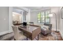 Bright office space featuring a desk, chair, and comfortable seating at 10328 Lemington Dr, Mint Hill, NC 28227