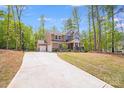 Charming two-story home featuring a two-car garage, inviting front porch and a basketball court at 11215 Dappled Light Trl, Charlotte, NC 28227