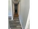 Hallway with modern gray-brown flooring and light blue walls, offering a clean and updated design at 131 Mays Ct, Rock Hill, SC 29730