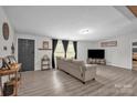 Comfortable living room with neutral tones, a large window, and modern flooring at 151 Brown Farms Dr, Cleveland, NC 27013