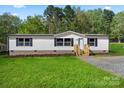 Charming single-story home with lush lawn and inviting entrance, perfect for comfortable living at 1649 Cloudburst Cir # 6, Lincolnton, NC 28092
