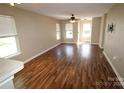 Open-concept living room with hardwood floors, plenty of natural light, and seamless transition to other spaces at 2043 Shady Pond Dr, Clover, SC 29710