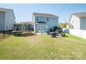 Large backyard featuring a patio area, a trampoline, and ample space for recreational activities at 2207 Atwell Glen Ln, Pineville, NC 28134