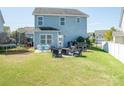 Spacious backyard with a patio area, perfect for outdoor entertaining and relaxation at 2207 Atwell Glen Ln, Pineville, NC 28134