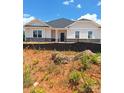 New construction single-story home featuring a gray and white exterior and a dark gray roof at 228 Mountain Island Dr # 38, Statesville, NC 28677