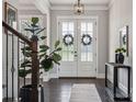 Elegant entryway with hardwood floors, stylish decor, and lots of natural light at 2311 Lochview St, Pineville, NC 28134