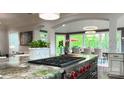 Gourmet kitchen with granite countertops, a stainless steel range, and an open layout at 2500 Giverny Dr, Charlotte, NC 28226