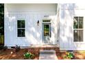 Charming entrance with brick-lined steps, craftsman door, and decorative plantings at 2501 Elon St, Charlotte, NC 28208