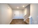 Inviting entryway with hardwood floors and staircase at 580 N Sparkleberry St, Chester, SC 29706