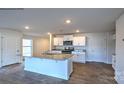 Modern kitchen features granite countertops, stainless steel appliances, and a spacious island at 580 N Sparkleberry St, Chester, SC 29706