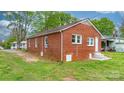 A neat brick house featuring a clean exterior and a well-kept lawn at 728 21St Sw St, Hickory, NC 28602