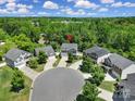 Aerial view of home nestled in a cul-de-sac surrounded by mature trees at 861 Watling St, Fort Mill, SC 29715