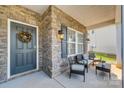 Inviting front porch with stone accents and seating area at 861 Watling St, Fort Mill, SC 29715