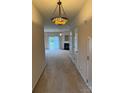 Inviting living room with fireplace and sliding glass door to the back yard at 9668 Walkers Glen Nw Dr, Concord, NC 28027