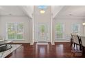Bright foyer featuring hardwood floors, elegant details, and a decorative glass front door at 9867 Travertine Trl, Davidson, NC 28036