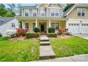 Attractive two-story home with a welcoming front porch and well-maintained landscaping at 12531 Morning Creek Ln, Charlotte, NC 28214