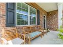Inviting front porch with comfortable seating, perfect for relaxing and enjoying the outdoors at 127 Slip Shot Ln, Troutman, NC 28166