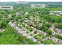 Aerial view showcases neighborhood amenities including a dock, tennis courts, pool, and clubhouse near Lake Norman at 135 Coronilla Rd, Mooresville, NC 28117