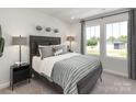 Cozy bedroom with a large window for natural light and comfortable furnishings at 138 Shepherds Landing Dr, Mooresville, NC 28115