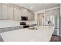 Modern kitchen featuring stainless steel appliances, a white quartz countertop, and a tile backsplash at 138 Shepherds Landing Dr, Mooresville, NC 28115