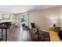 Bright and inviting living room with hardwood floors and access to a private balcony at 1620#F Arlyn Cir, Charlotte, NC 28213