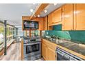 Charming kitchen featuring wooden cabinets, modern appliances, and a view of the adjoining room at 2106 4Th Ne St, Hickory, NC 28601