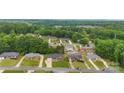 Aerial shot of houses and tree-lined streets in a suburban neighborhood, showcasing well-maintained properties at 2459 Glenridge Dr, Gastonia, NC 28054