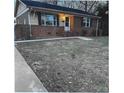 Traditional brick home with a small lawn, showcasing a classic and timeless design at 2831 Denview Ln, Charlotte, NC 28208