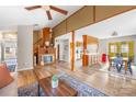 Inviting living room with a fireplace, hardwood floors, and an open layout to the kitchen and dining area at 32 Heritage Ln, Shelby, NC 28150