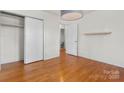 This is a standard bedroom with natural light and wood flooring with an ensuite bathroom and closet at 343 Wakefield Dr # C, Charlotte, NC 28209